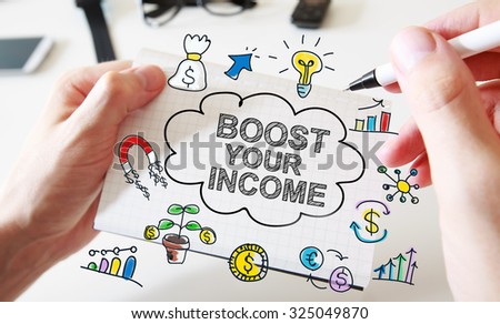 Mans hand drawing Boost Your Income concept on white notebook