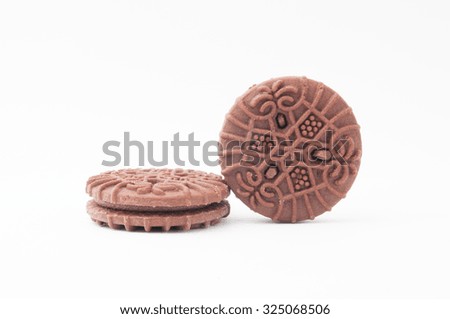 The chocolate sandwich biscuits on white background. -stock photo.