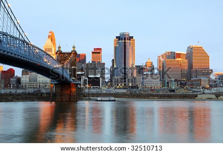 Downtown Cincinnati, Ohio and the John A. Roebling Suspension Bridge at sunrise.