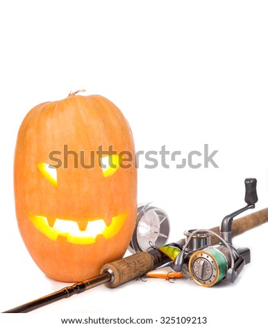 halloween pumpkin head with fishing tackles on white background