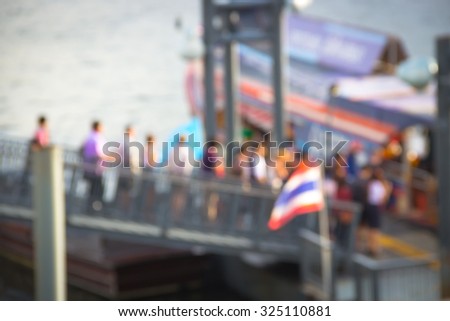 Abstract blur the people waiting passenger ship at the harbor.