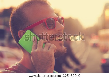 Man with cellphone outdoors.