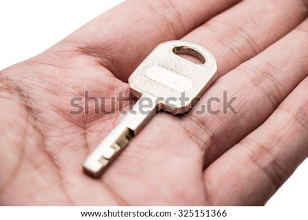 Key on hand on white background