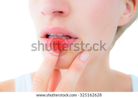 Thoughtful woman touching her lips against highlighted pain