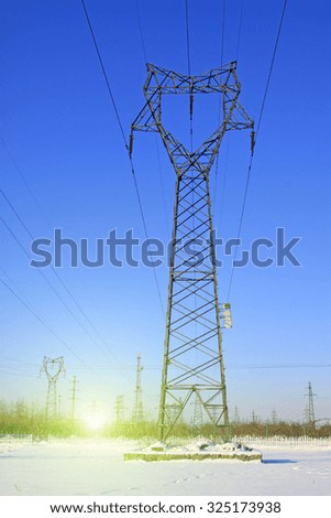 Electric power tower in the snow, closeup of photo