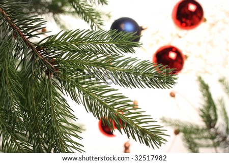 Branch of a christmas three with balls in shallow focus