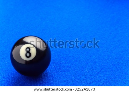 Eight billiard ball in a blue pool table. Royalty-Free Stock Photo #325241873