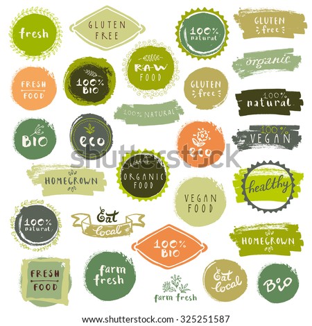 Retro set of 100% bio, organic, gluten free, eco, healthy food labels. Hand drawn logo templates with floral and vintage elements for restaurant menu or food package. Vector badges in hipster style Royalty-Free Stock Photo #325251587