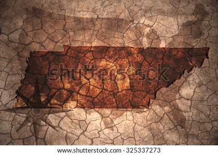Tennessee state map on vintage usa map, crack paper background