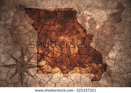 Missouri state map on vintage usa map, crack paper background