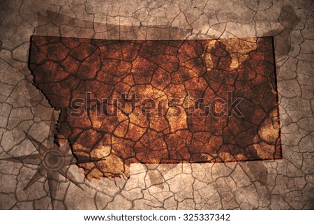 Montana state map on vintage usa map, crack paper background