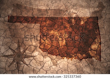 Oklahoma state map on vintage usa map, crack paper background