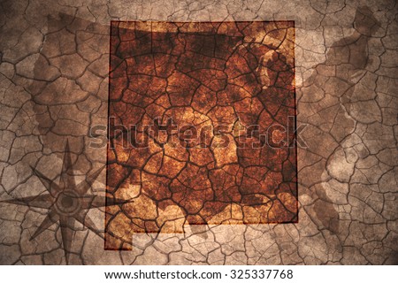 New Mexico state map on vintage usa map, crack paper background