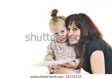 happy young mother and cute little girl reading book isolated on white background
