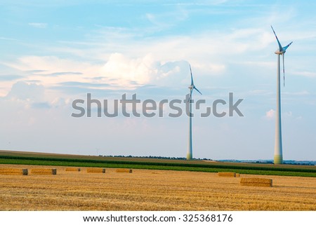Large view on the windmills on the field