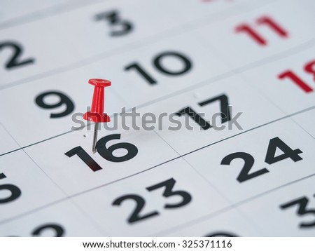 Thumbtack in calendar concept for important date, busy day, appointment or meeting reminder Royalty-Free Stock Photo #325371116