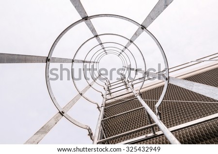 ladder leading up to the top of an industrial