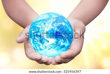 Hands palm up take care of blue global earth over blur background Think Earth concept  for poster advertising magazine or design Elements of this image furnished by NASA