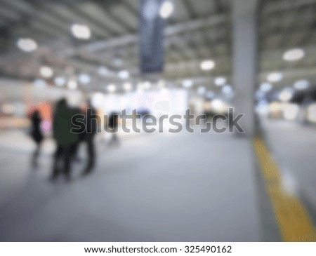 People silhouettes, generic background. Intentionally blurred post production.