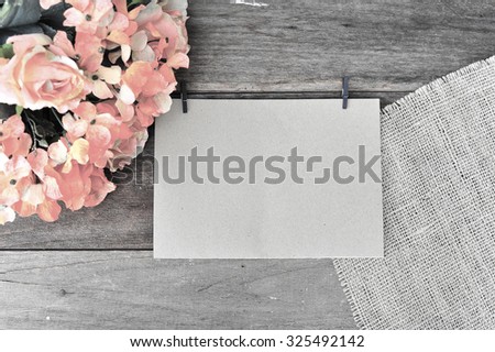Paper, notepaper with orange flowers on the table, vintage retro style.
