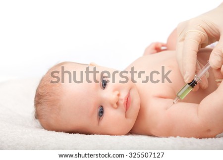Close-up shot of pediatrician giving a three month baby girl  intramuscular injection of a vaccine in arm