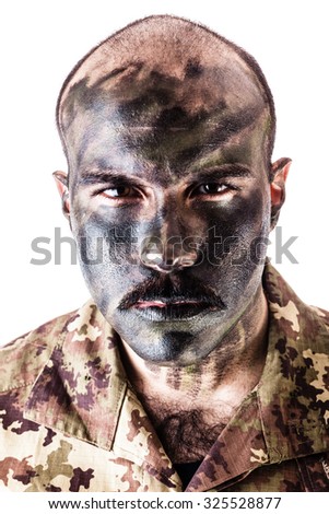 a soldier wearing camouflage clothing and army face paint isolated over a white background