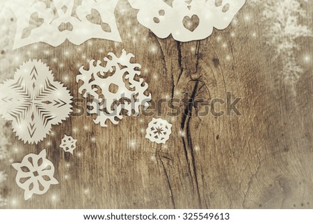 Christmas snowflakes on the old board.