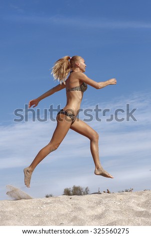 Jogging women. Running girl on the beach.