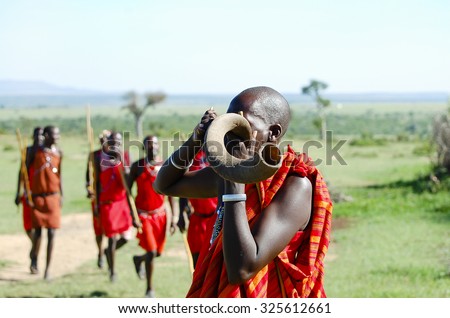 Masai Kudu Horn Blowing - Kenya Royalty-Free Stock Photo #325612661