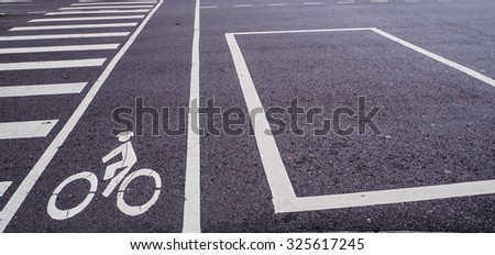 Bicycle lane sign across the road