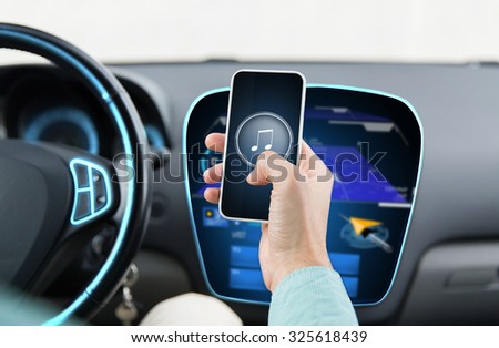 transport, business trip, technology and people concept - close up of male hands with musical note icon on smartphone screen in car