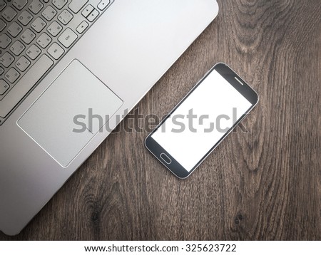 Business concept, laptop and smartphone with blank screen. Mockup