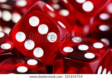 closeup of many red transparent dices Royalty-Free Stock Photo #325654754