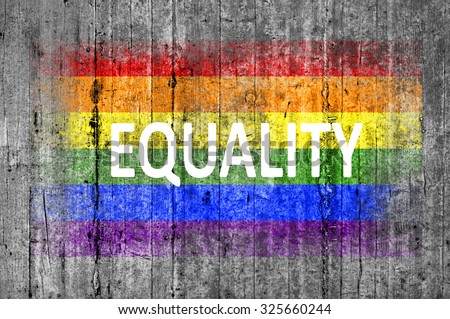 Equality and LGBT flag painted on background texture gray concrete Royalty-Free Stock Photo #325660244