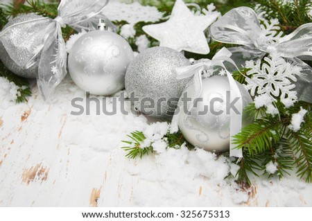 Christmas decoration silver baubles with Christmas tree and snow