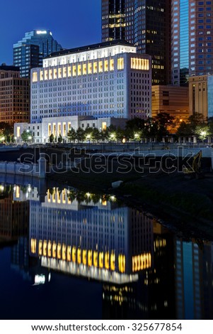 COLUMBUS, OHIO  - CIRCA SEPTEMBER 05, 2015 - Evening arrives at the Columbus Ohio skyline with lights of the Supreme Court building being reflected. 