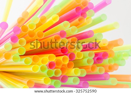 Colorful plastic straws used for drinking soft drinks, fresh juices, smoothies which are using in hotels and restaurants.