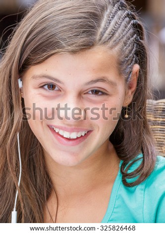 closeup of a pretty girl smiling with a headset