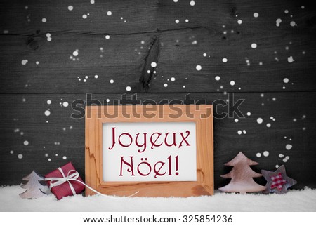 Gray Christmas Card With Brown Picture Frame On White Snow With Snowflakes. Red French Text Joyeux Noel Mean Merry Christmas, Tree, Gift And Star. Rustic Wooden, Vintage Background. Black And White