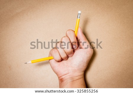 Hand with broken pencil. Business frustrations, Job stress and Failed exam concept.