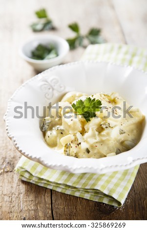 Potato salad with eggs and gherkins