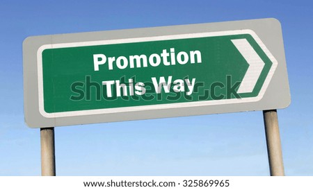 Green road sign with the message of Promotion This Way concept against a blue sky background