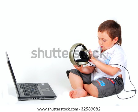 little boy, computer, headphones on a white background
