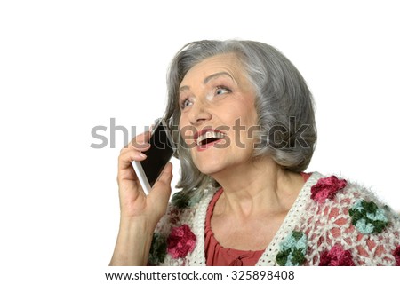 Portrait of elderly lady with mobile phone on white background