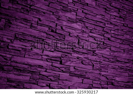 purple color pattern of modern style design decorative uneven cracked real stone wall surface background texture