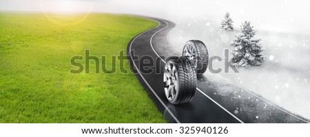 Winter and summer tires on the road Royalty-Free Stock Photo #325940126