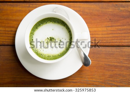 Green tea, milk, hot afternoon.