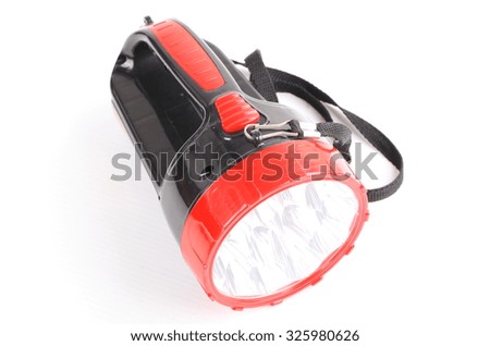Red and black flashlight isolated on white