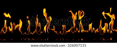 Fire on a black background. The picture is very wide. Perfect for wallpaper.