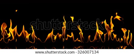 Fire on a black background. The picture is very wide. Perfect for wallpaper.